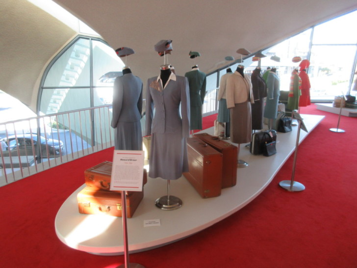 a display of a dress and luggage