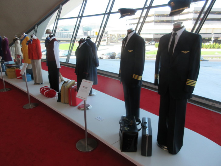 a mannequins with uniform and luggage