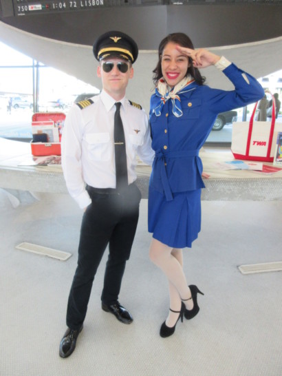 a man and woman in uniform saluting