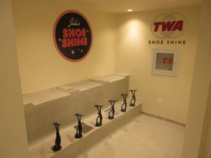a shoe shine room with a sign