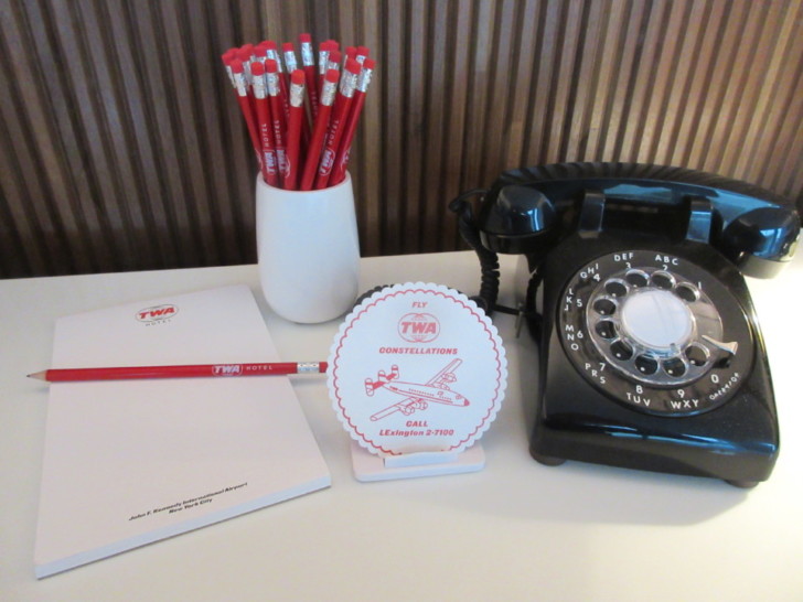 a telephone and notepad on a table