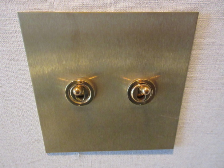 a gold switch with two switches