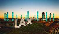 a large sign with lights in the background