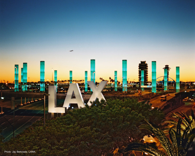 a large sign with a city in the background