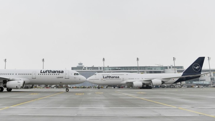 two airplanes on a runway