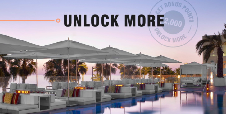a pool with umbrellas and chairs