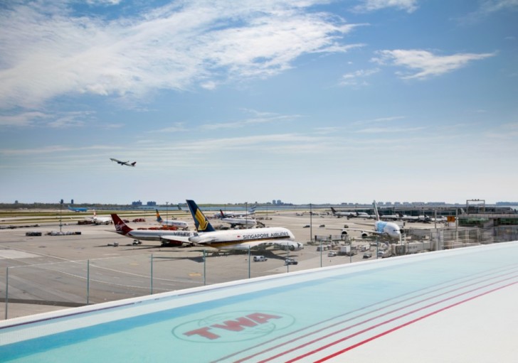 a group of airplanes at an airport