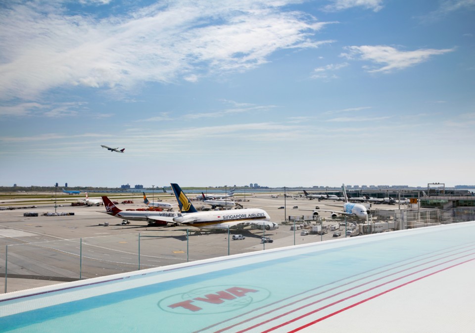 a group of airplanes at an airport