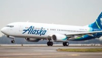 a white airplane on a runway