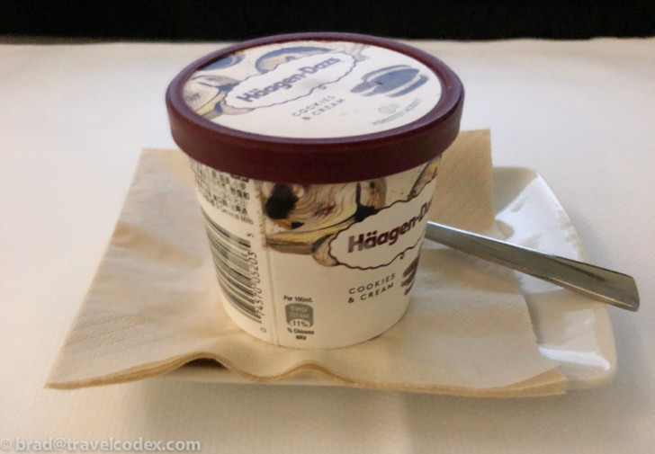 a cup of ice cream on a napkin
