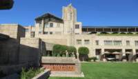 a building with a lawn and a sign
