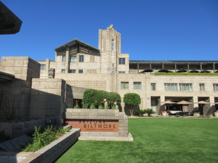 a building with a lawn and a sign