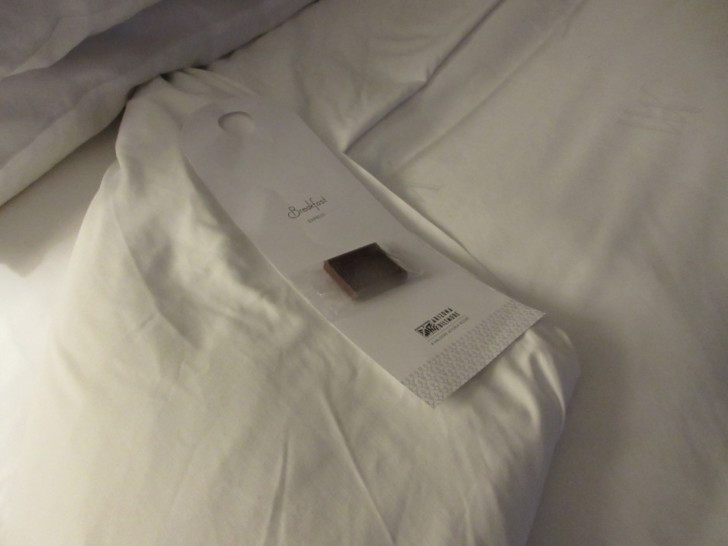 a package of chocolate in a white package on a white bed