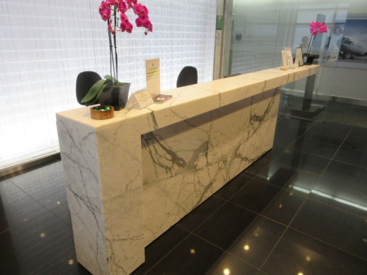a marble counter with flowers and cards on it