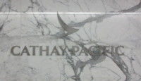a sign on a marble wall