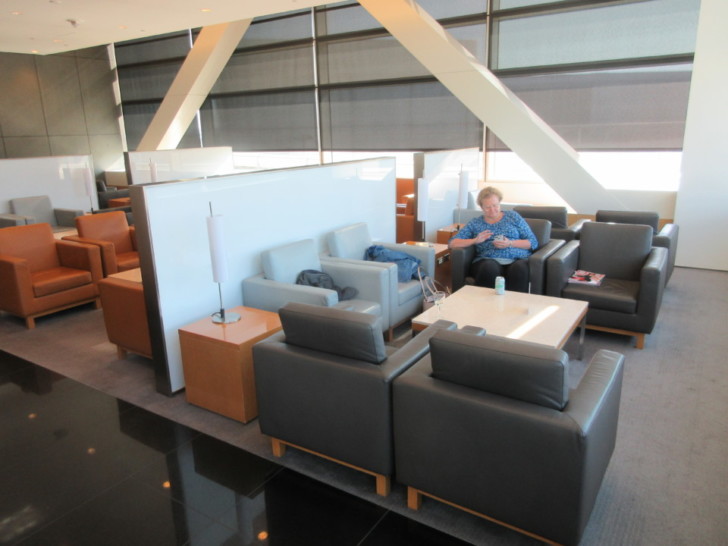 a woman sitting in a lounge area