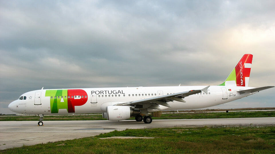 a white airplane on a runway
