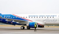 a man walking next to a plane