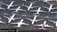 a group of airplanes on a runway