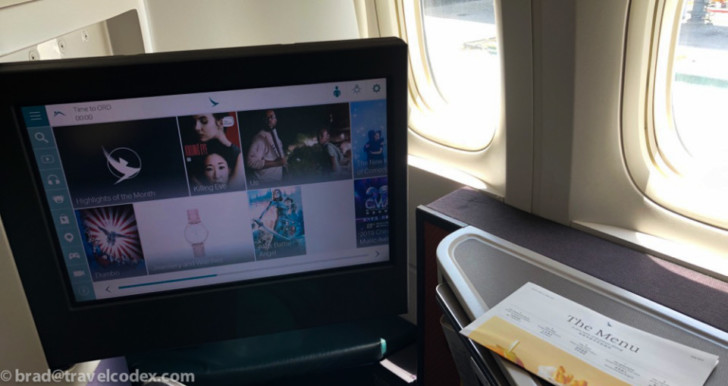 a computer screen on a plane