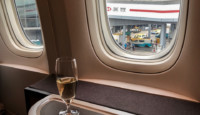 a glass of wine on a table in a plane