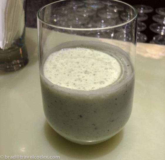a glass of white liquid