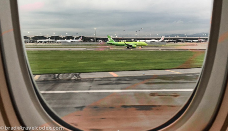 a view of an airplane on a runway