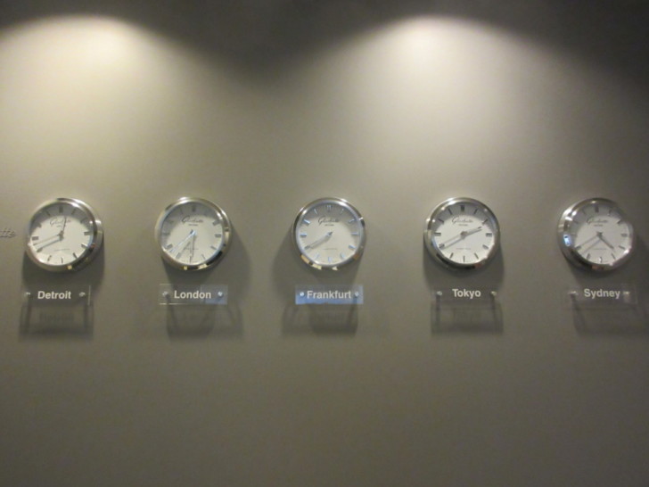 a group of clocks on a wall
