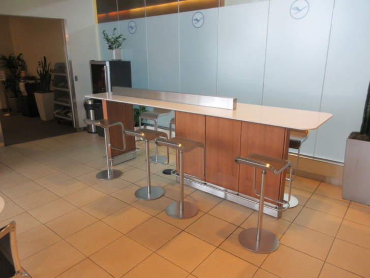 a bar with stools in a room