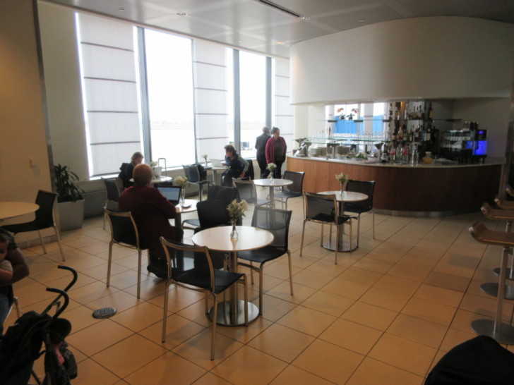 people sitting at tables in a room