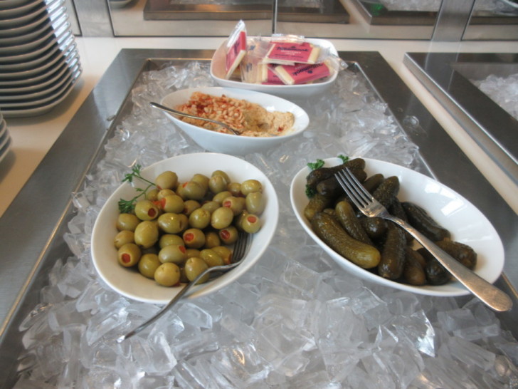 a group of bowls of food on ice