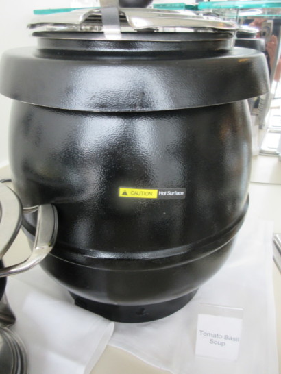a black pot with a yellow label
