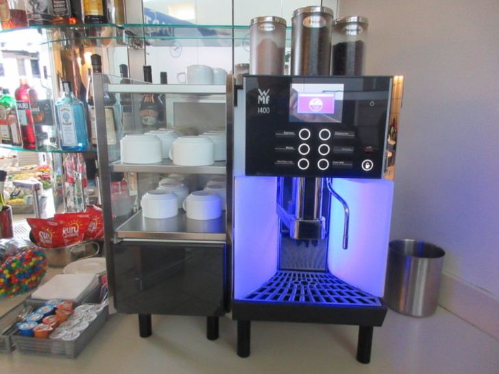 a coffee machine with a blue light