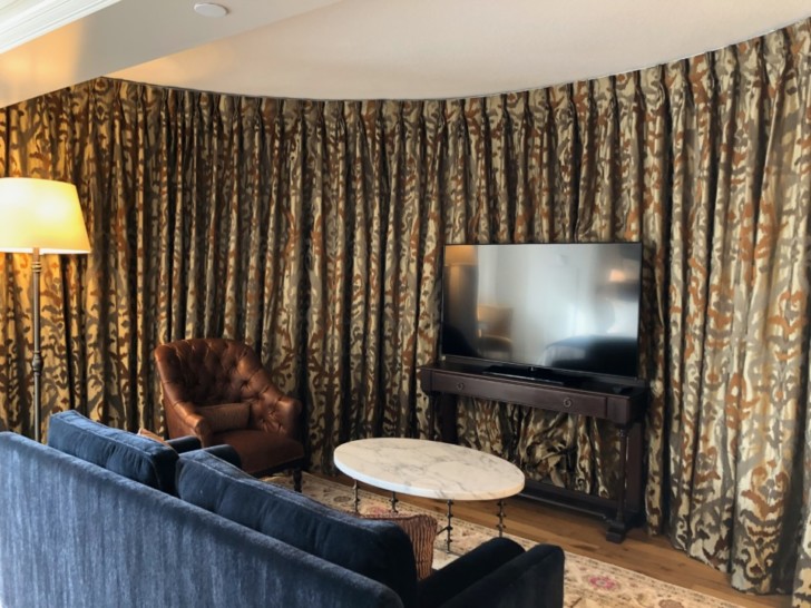 a living room with a tv and couches
