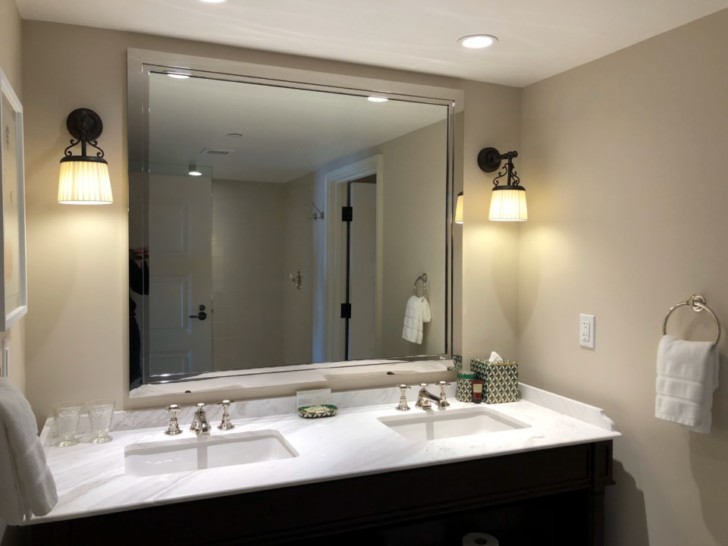 a bathroom with a mirror and sink