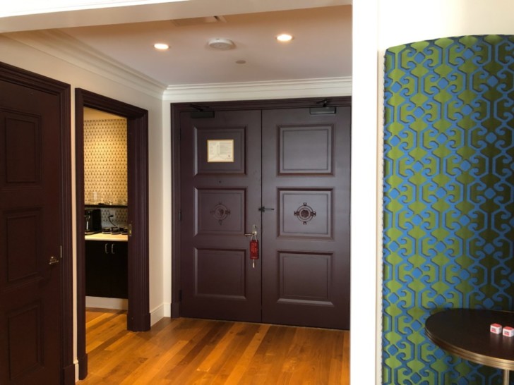 a room with a door and a table