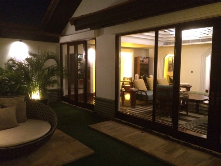 a room with glass doors and a chair