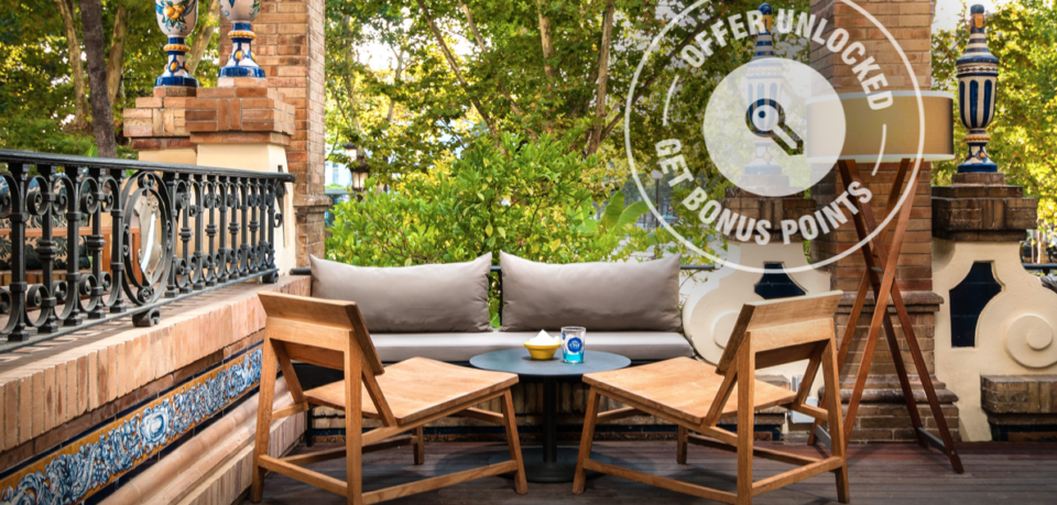 a patio with a table and chairs