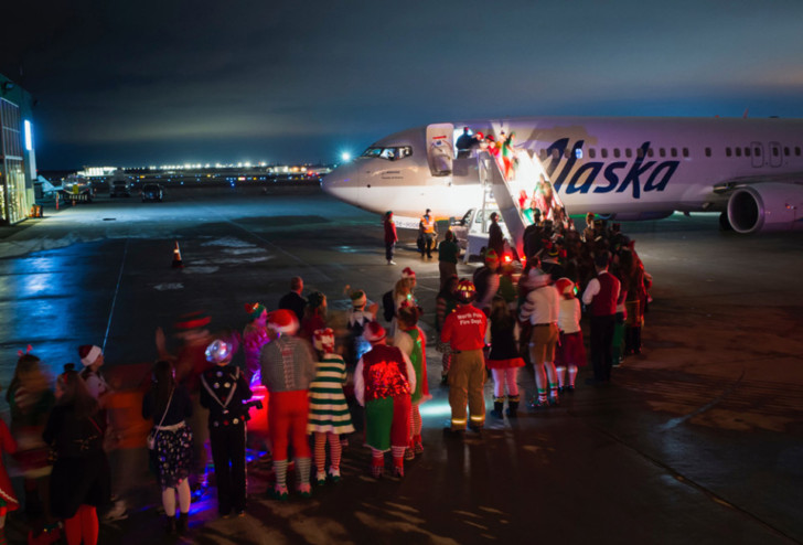 a group of people boarding an airplane