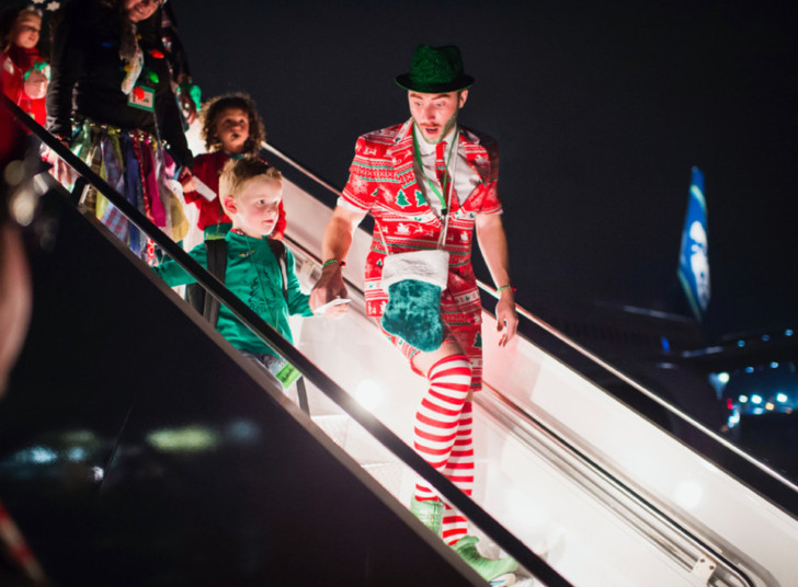 a man and child on an escalator