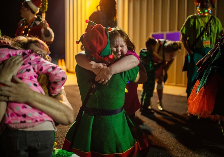 a group of people hugging each other