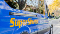 a blue van with yellow writing on it