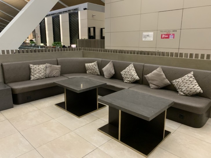 a couch with pillows in a room