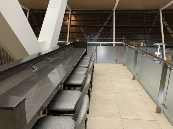 a counter with chairs in a room