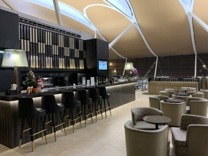 a bar with chairs and tables