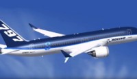 a blue and white airplane in the sky
