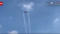 a plane flying in the sky