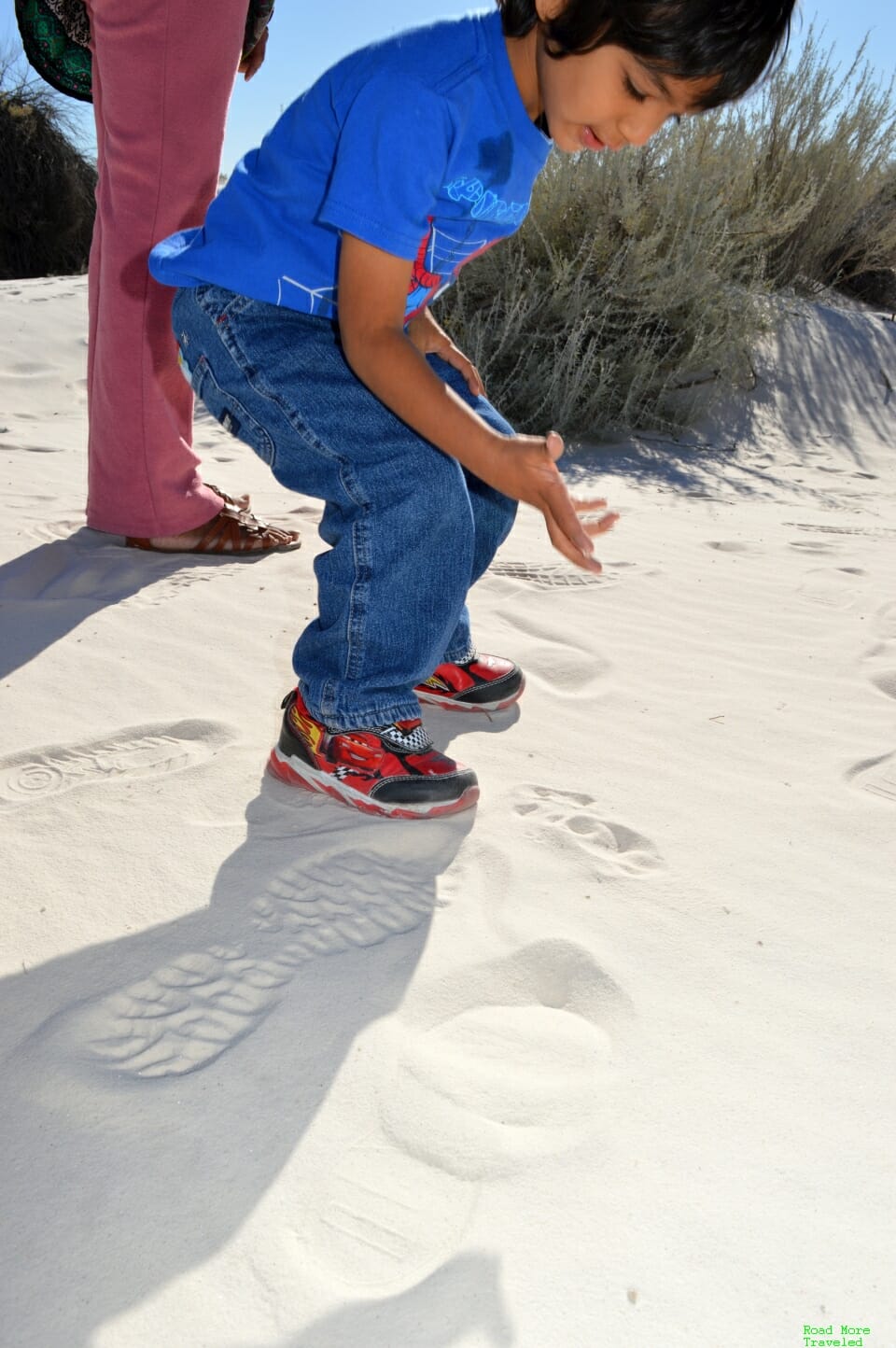Ashok examining the sand