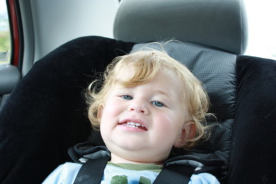 a close-up of a baby in a car seat
