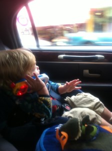 a child in a car seat